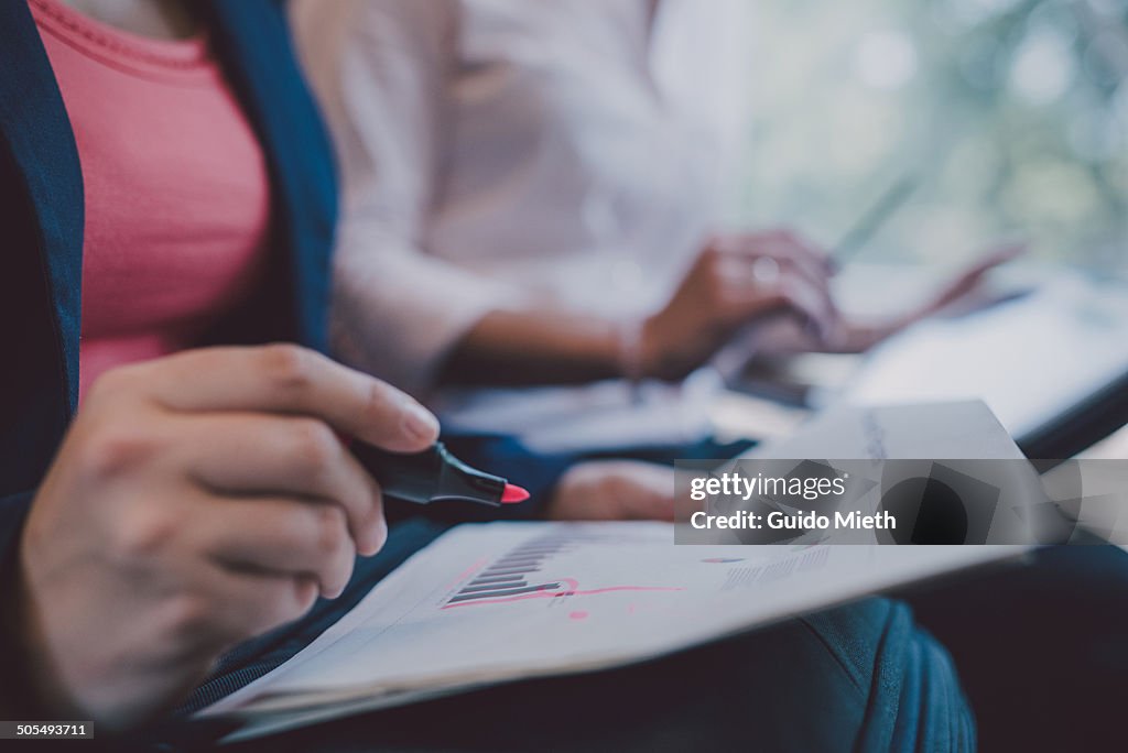 Businesswomen working together.