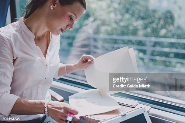 businesswoman working in train. - documento foto e immagini stock