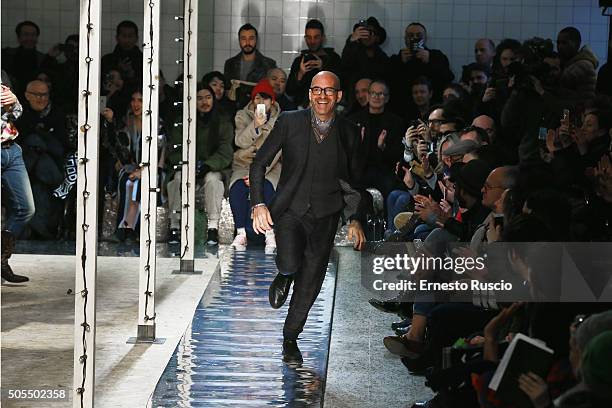 Designer Antonio Marras acknowledges the applause of the public after the Antonio Marras show during Milan Men's Fashion Week Fall/Winter 2016/17 on...