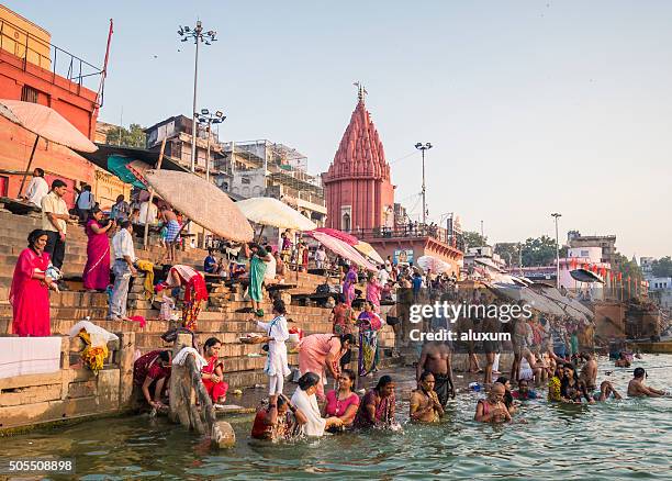 pilgrims bathing in dasaswamedh ghat varanasi - ganges river stock pictures, royalty-free photos & images