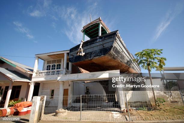 Boat on a roof top in Banda Aceh, Indonesia, 2009. The boat has remained in position since the Indian Ocean earthquake and tsunami of 2004.