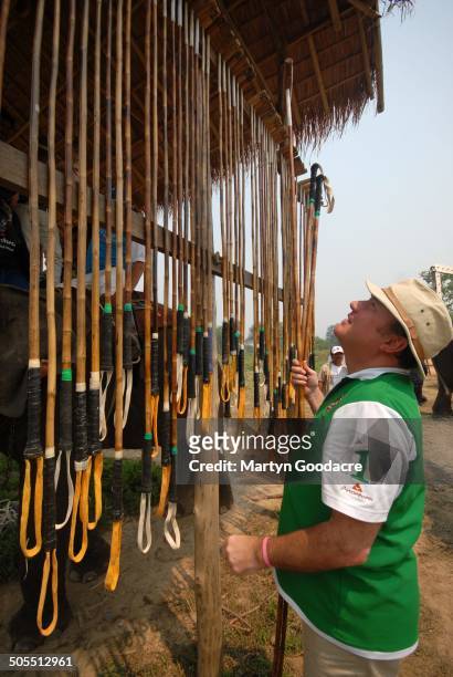 Competitor hanging up a polo mallet during the King's Cup Elephant Polo tournament at Chiang Rai in northern Thailand, 2010.