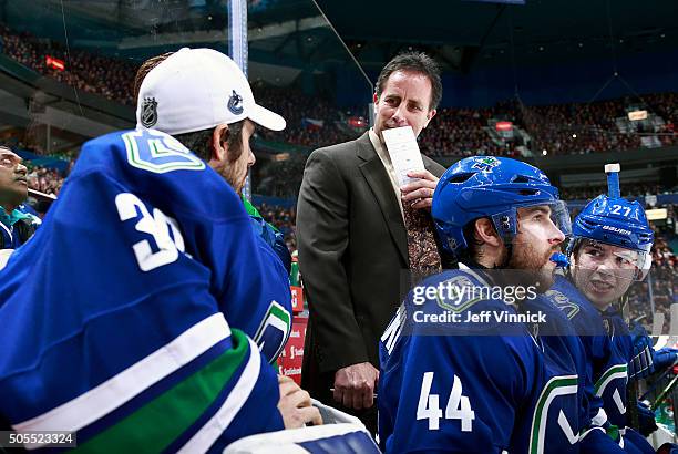 Assistant coach Doug Lidster of the Vancouver Canucks looks on from the bench during their NHL game against the Florida Panthers at Rogers Arena...