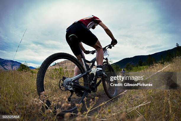 mountain bike race - cross country cycling stock pictures, royalty-free photos & images