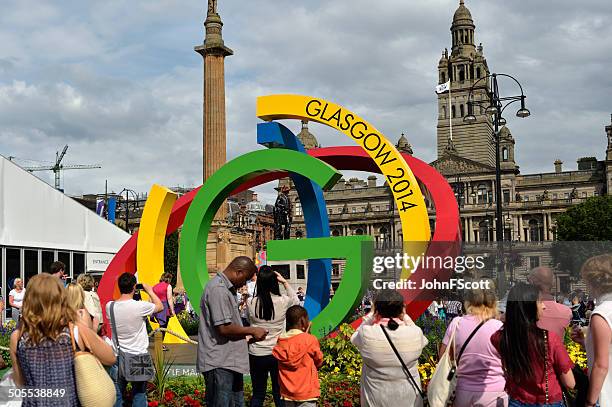 members of the public in george square glasgow 2014 - commonwealth games glasgow stock pictures, royalty-free photos & images