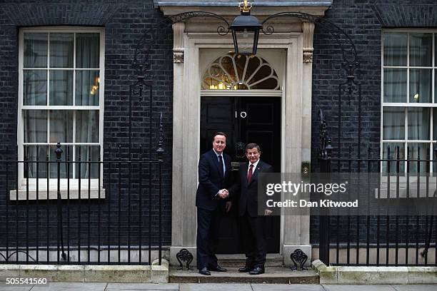 Turkish Prime Minister Ahmet Davutoglu is greeted by British Prime Minister David Cameron at 10 Downing Street on January 18, 2016 in London,...