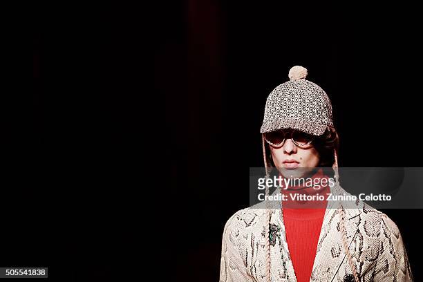 Model walks the runway at the Gucci show during Milan Men's Fashion Week Fall/Winter 2016/17 on January 18, 2016 in Milan, Italy.