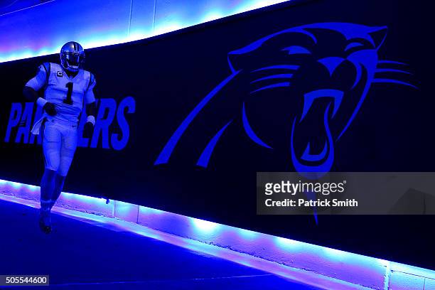 Cam Newton of the Carolina Panthers runs through the tunnel before playing the Seattle Seahawks at the NFC Divisional Playoff Game at Bank of America...