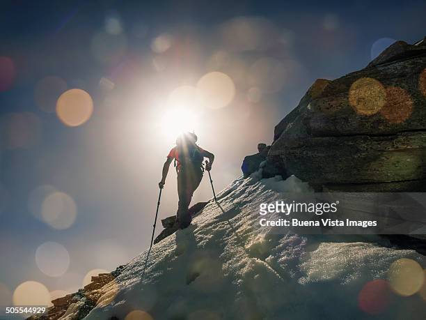 Lone climber on a mountain at sunrise