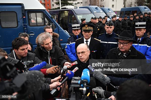 French Interior minister Bernard Cazeneuve , flanked by Grenoble's prosecutor Jean-Yves Coquillat , answers to journalists' questions, on January 18,...