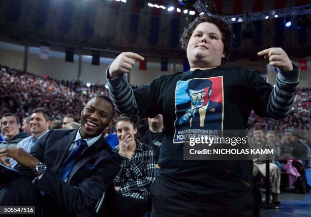 Supporter wearing a t-shirt with US Republican presidential candidate Donald Trump attends a Trump rally at Liberty University in Lynchburg,...