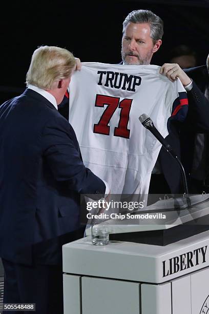 Liberty University President Jerry Falwell, Jr. Presents Republican presidential candidate Donald Trump with a sports jersey after he delivered the...