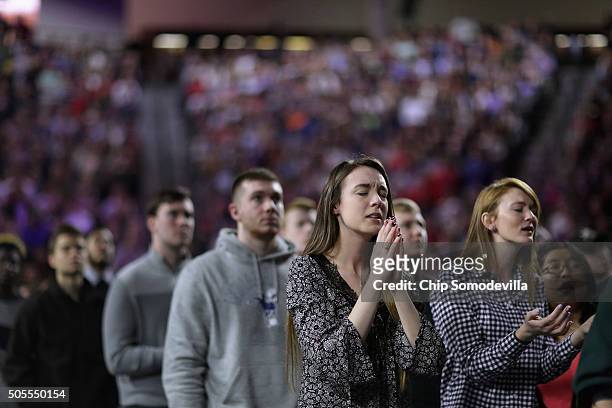 Thousands of students, supporters and invited guests sing songs of Christian praise before Republican presidential candidate Donald Trump delivers...