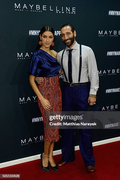 Host Rebecca Mir and Massimo Sinato attend the 'The Power Of Colors - MAYBELLINE New York Make-Up Runway' show during the Mercedes-Benz Fashion Week...