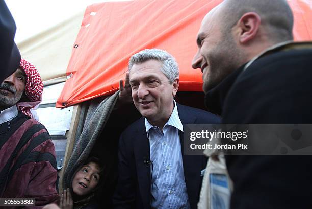 Boy peers up at Filippo Granti, the new UNHCR High Commissioner as he visits the Zaatari camp for Syrian refugees, on January 18, 2016 in Zaatari,...