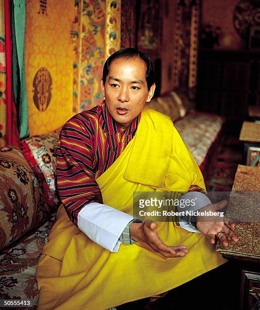 King Jigme Singye Wangchuck of Bhutan speaking in serious portrait in TIME interview.
