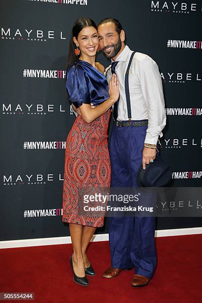 Host Rebecca Mir and Massimo Sinato attend the 'The Power Of Colors - MAYBELLINE New York Make-Up Runway' show during the Mercedes-Benz Fashion Week...