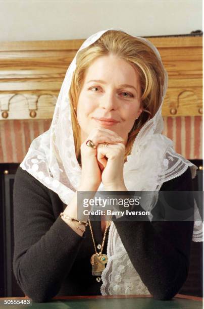 Jordanian King Hussein's widow Queen Noor in smiling portrait during TIME interview .