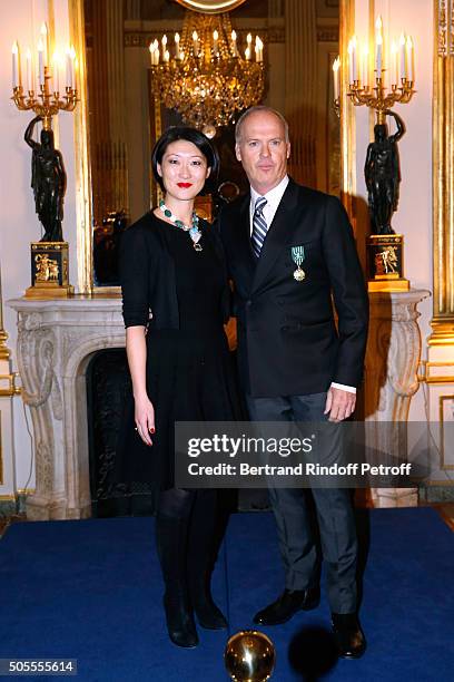 French minister of Culture and Communication Fleur Pellerin a,d Michael Keaton attend Actor Michael Keaton received the medal of Officer of the Order...