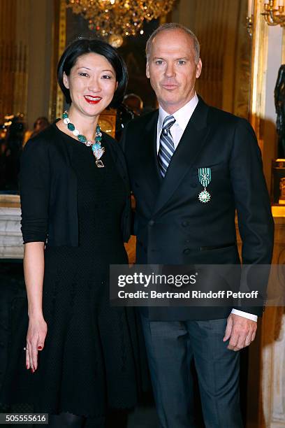 French minister of Culture and Communication Fleur Pellerin a,d Michael Keaton attend Actor Michael Keaton received the medal of Officer of the Order...