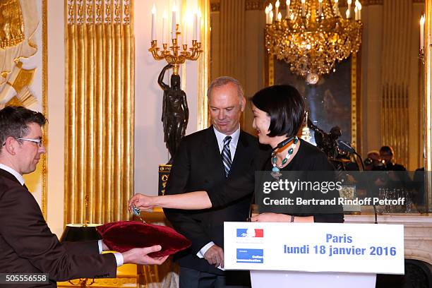 French minister of Culture and Communication Fleur Pellerin a,d Michael Keaton attend Actor Michael Keaton received the medal of Officer of the Order...