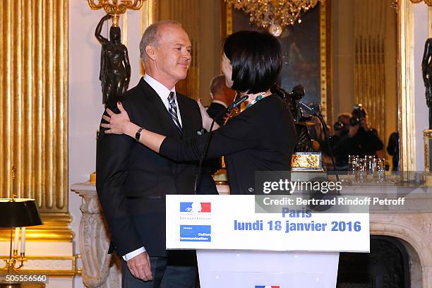 French minister of Culture and Communication Fleur Pellerin a,d Michael Keaton attend Actor Michael Keaton received the medal of Officer of the Order...