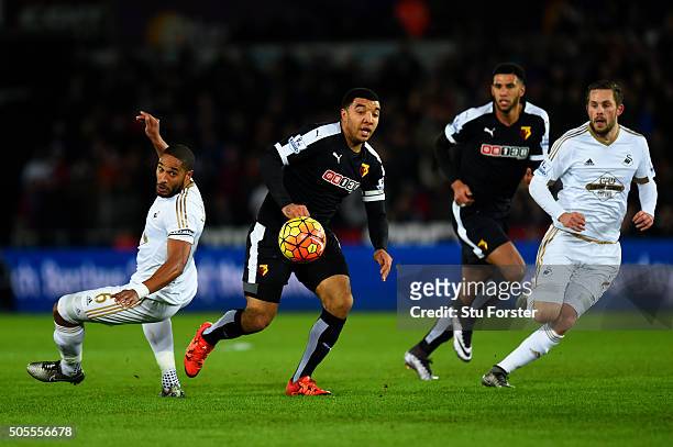 Troy Deeney of Watford chases the ball ahead of Ashley Williams of Swansea City and Gylfi Sigurdsson of Swansea City during the Barclays Premier...