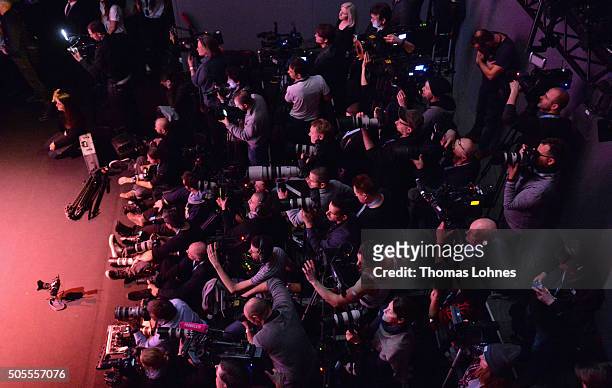 Photographers work on the media riser during the 'The Power Of Colors - MAYBELLINE New York Make-Up Runway' show during the Mercedes-Benz Fashion...