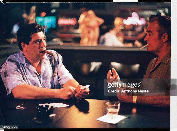Actors Vincent Pastore & Tony Sirico playing cards in scene fr. HBO cable TV series The Sopranos