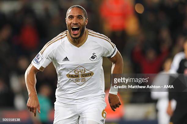 Ashley Williams of Swansea City celebrates after scoring a goal to make it 1-0 during the Barclays Premier League match between Swansea City and...
