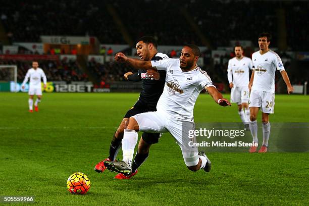 Ashley Williams of Swansea City wins the ball from Troy Deeney of Watford during the Barclays Premier League match between Swansea City and Watford...