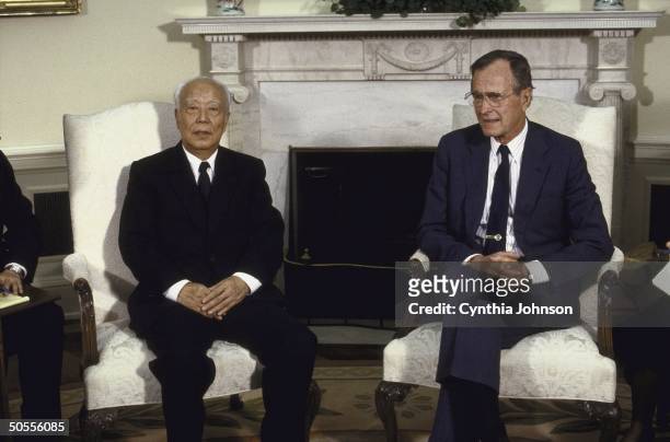 President George H. W. Bush meeting with Chinese Vice-Premier Wan Li, in Oval Office.