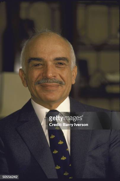 King Hussein smiling during `Time' interview at royal palace.