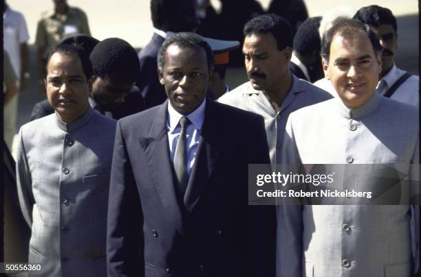 India's Prime Minister Rajiv Gandhi standing with Angola's Pres. Jose Eduardo dos Santos during his state visit.