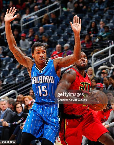 Shelvin Mack of the Atlanta Hawks drives againts Keith Appling of the Orlando Magic at Philips Arena on January 18, 2016 in Atlanta, Georgia. NOTE TO...