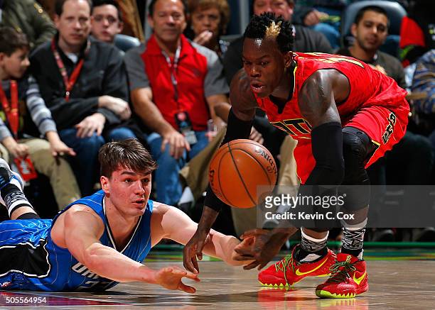 Mario Hezonja of the Orlando Magic saves a loose ball against Dennis Schroder of the Atlanta Hawks at Philips Arena on January 18, 2016 in Atlanta,...