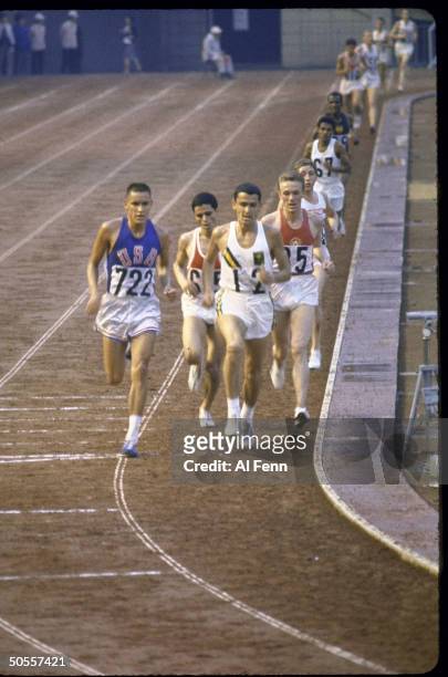 Billy Mills of the US wins the 10,000 meters run at Summer Olympics.