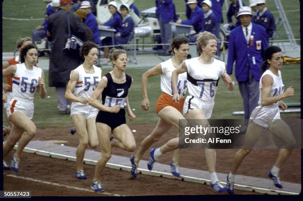 Women athletes in action during the 800 meter run at Summer Olympics.