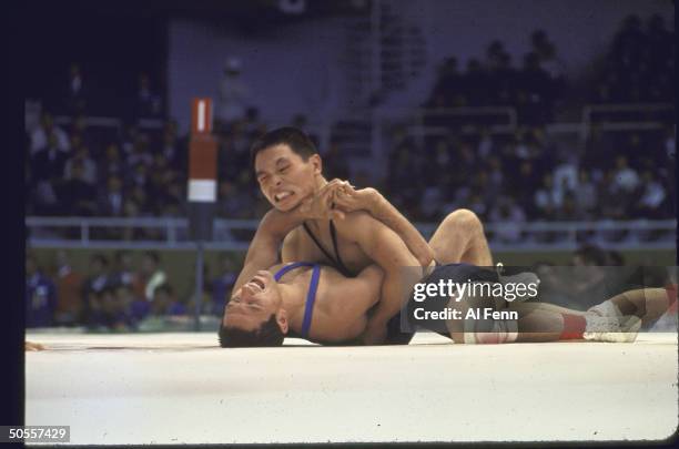 Unidentified wrestlers in action in the freestyle eliminations at Summer Olympics.