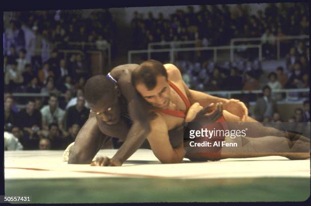 Bobby Douglas of the US featherweight wrestling team vs at Summer Olympics.
