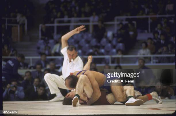 Wrestling freestyle eliminations at Summer Olympics.