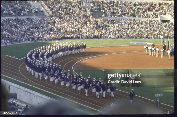 Team led by Rafer Johnson enters Rome's Olympic Stadium during the opening ceremonies of the Summer Olympics.
