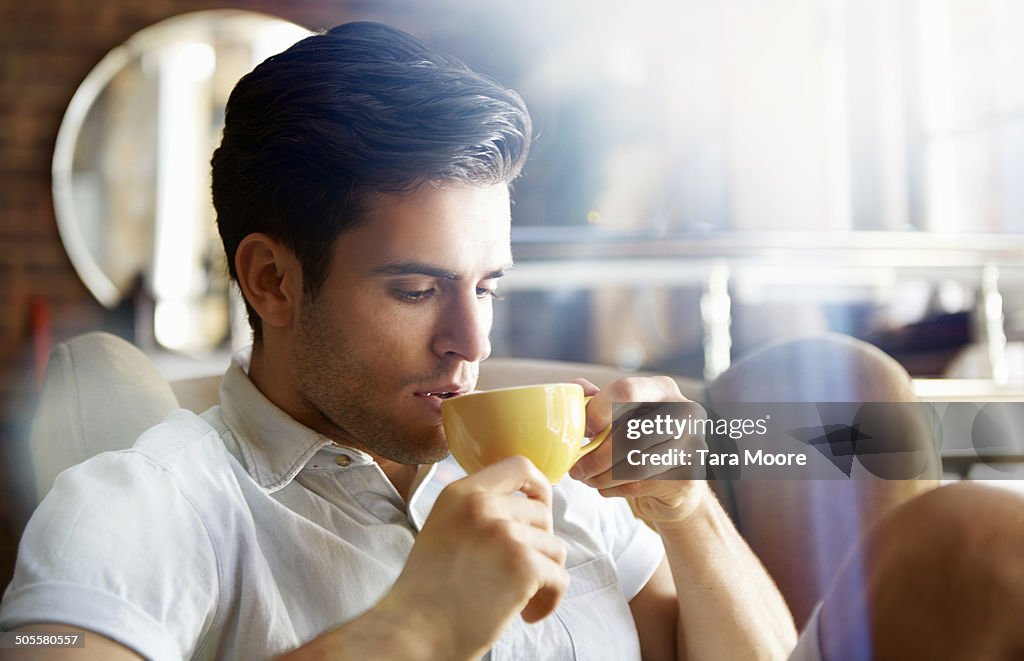 Man in cafe drinking coffee