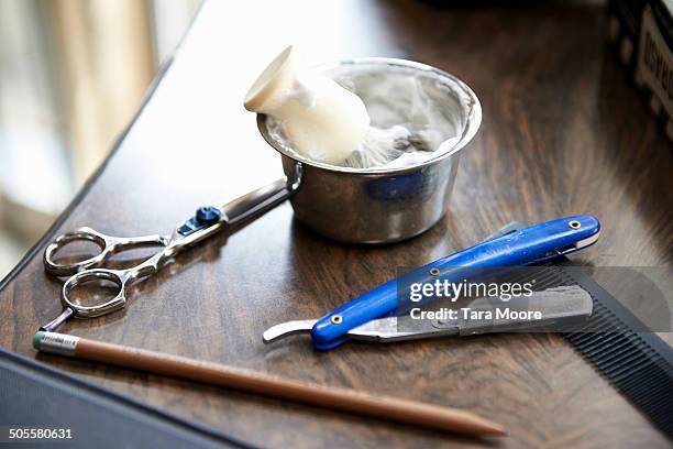 shaving cream an scissors at barber shop - barbers stock pictures, royalty-free photos & images