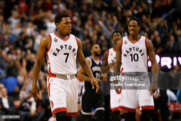 Toronto Raptors Kyle Lowry reacts to his three point shot with teammate Toronto Raptors DeMar DeRozan in the second half of their NBA basketball game...