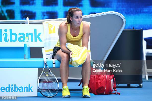 Jarmila Wolfe of Australia show her emotion after retiring from her her first round match against Anastasija Sevastova of Latvia during day two of...