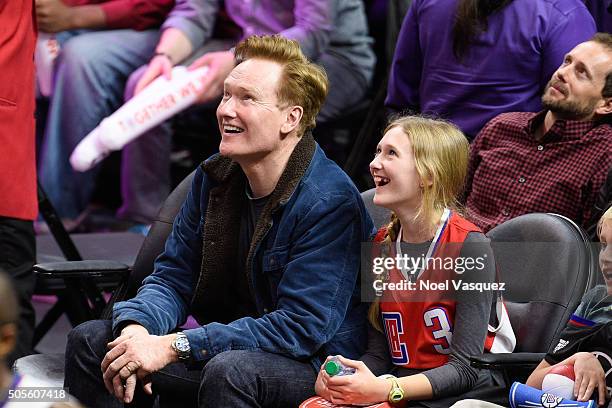 Conan O'Brien and his daughter Neve O'Brien attend a basketball game between the Houston Rockets and the Los Angeles Clippers at Staples Center on...