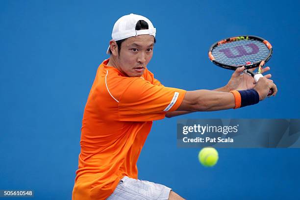Tatsuma Ito of Japan plays a backhand in his first round match against Radek Stepanek of Czech Republic during day two of the 2016 Australian Open at...