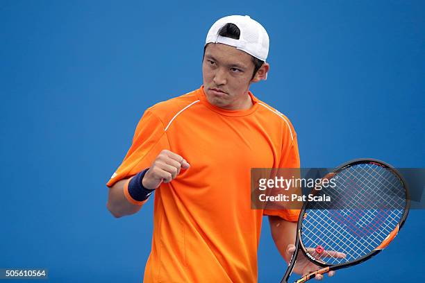 Tatsuma Ito of Japan celebrates in his first round match against Radek Stepanek of Czech Republic during day two of the 2016 Australian Open at...