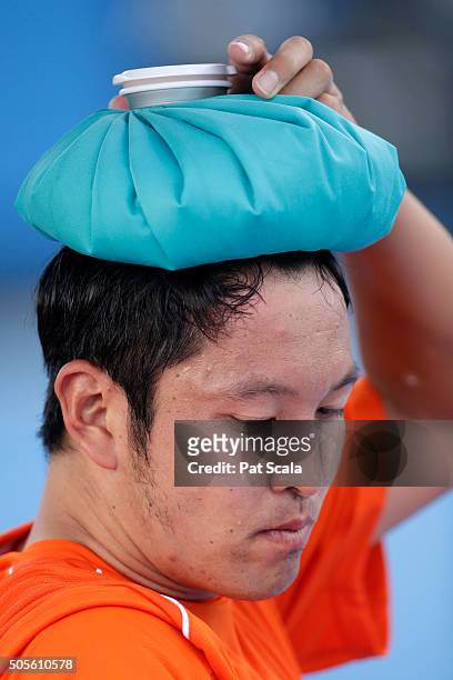 Tatsuma Ito of Japan cools down in between games in his first round match against Radek Stepanek of Czech Republic during day two of the 2016...